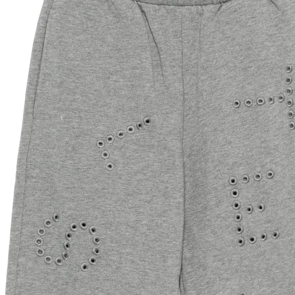 Брюки с люверсами